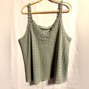 Maurice’s sage green tank top.